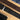 Personalized cork belt with engraved text on a wooden surface