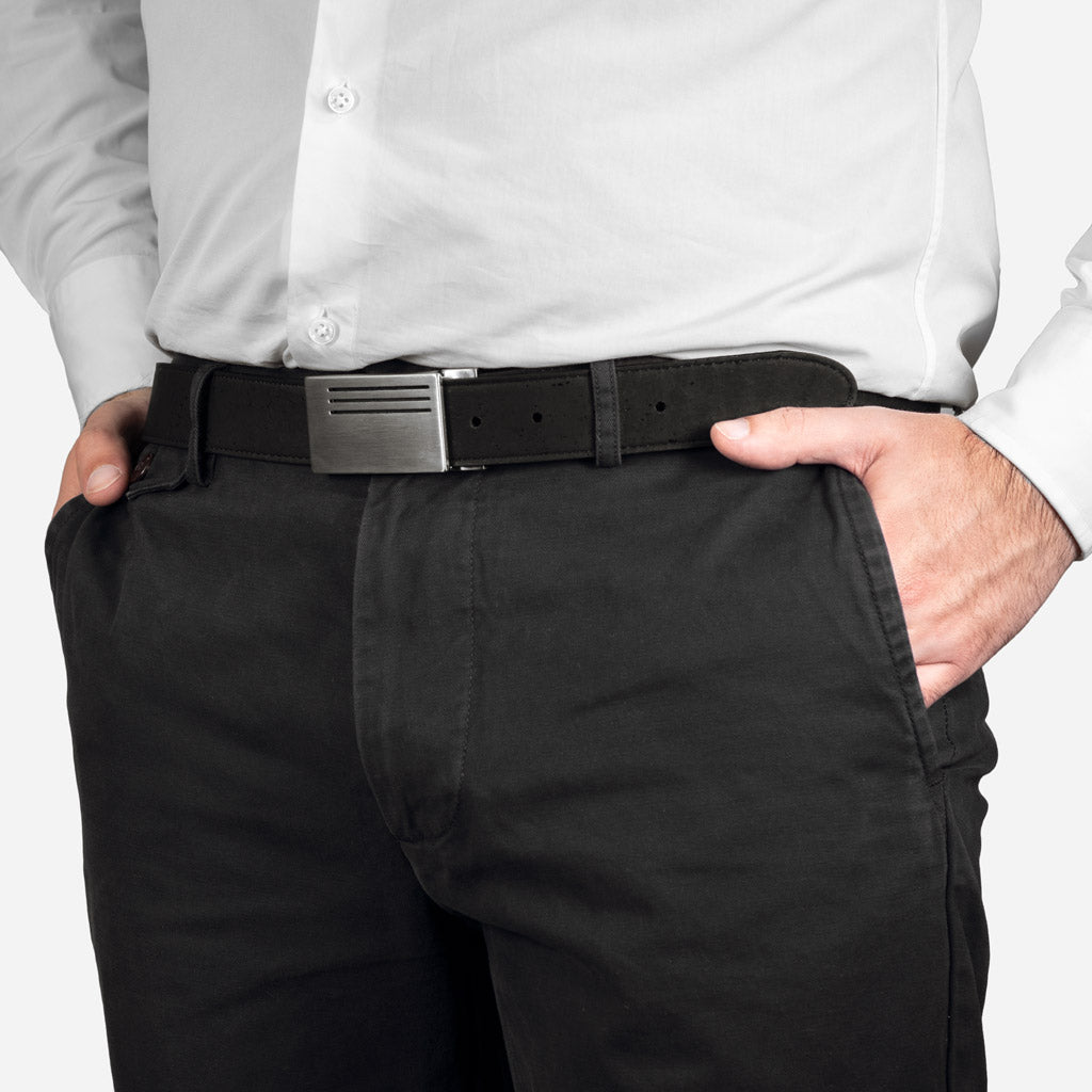 Man wearing a vegan reversible belt with plaque buckle made from genuine cork.