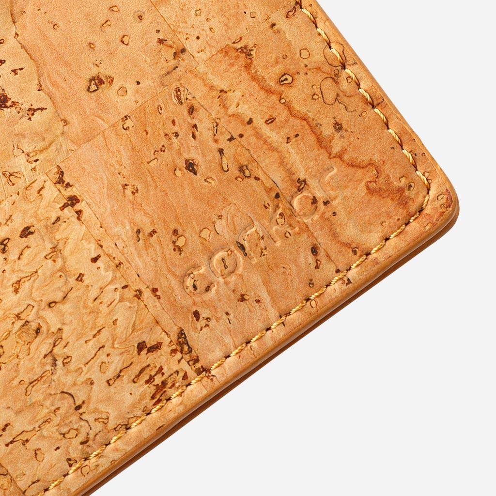 Closeup on the Corkor logo of the Cork Passcase Wallet.